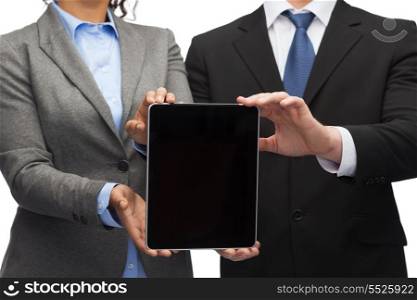 business, technology and internet concept - businessman and businesswoman with blank black tablet pc screen