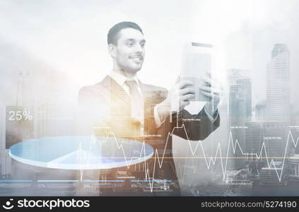 business, technology and marketing concept - businessman with tablet pc computer and charts over city and double exposure effect. businessman with tablet pc over city and charts