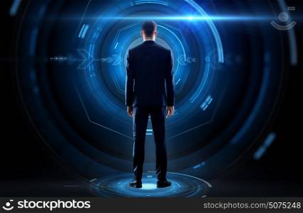 business, technology and people concept - businessman in suit and virtual projection over black background from back. businessman from back with virtual projection