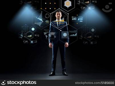 business, technology and people concept - businessman in suit and virtual screen over black background. businessman in suit over virtual screen