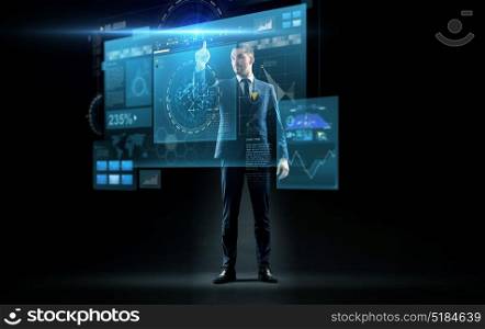 business, technology and people concept - businessman in suit touching virtual screen over black background. businessman in suit touching