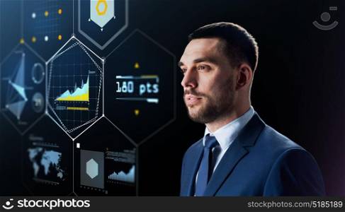 business, technology and people concept - businessman in suit with virtual screen projection over black background. businessman with virtual screen over black