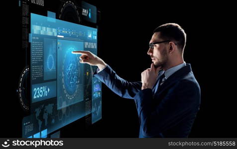 business, technology and people concept - businessman in suit with virtual screen projection over black background. businessman with virtual screen over black