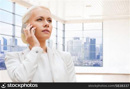 business, technology and people concept - businesswoman calling on smartphone over office room or new apartment background