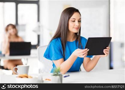 business, technology and people concept - businesswoman with tablet pc computer working at office. businesswoman with tablet pc working at office. businesswoman with tablet pc working at office