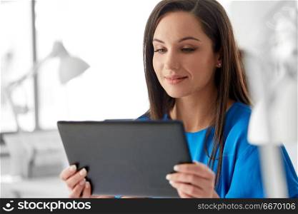 business, technology and people concept - businesswoman with tablet pc computer working at office. businesswoman with tablet pc working at office. businesswoman with tablet pc working at office