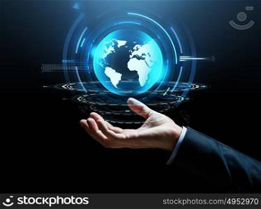 business, technology and people concept - close up of businessman hand with virtual earth projection over dark background. businessman hand virtual earth projection