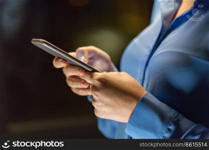 business, technology and people concept - close up of businesswoman hands with smartphone. close up of businesswoman hands with smartphone