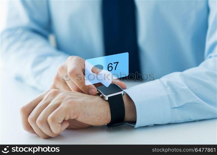 business, technology and people concept - close up of male hands wearing smart watch with social media icons. hands with smart watch and social media icons. hands with smart watch and social media icons