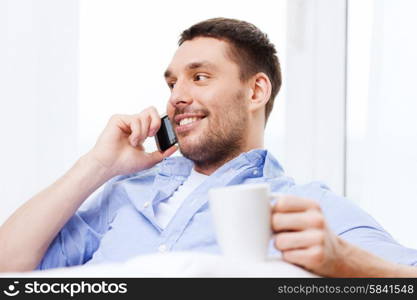 business, technology and people concept - close up of smiling businessman with smartphone talking