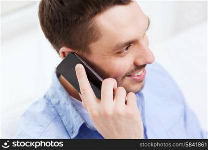 business, technology and people concept - close up of smiling businessman with smartphone talking