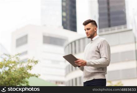 business, technology and people concept - man with tablet pc computer in city
