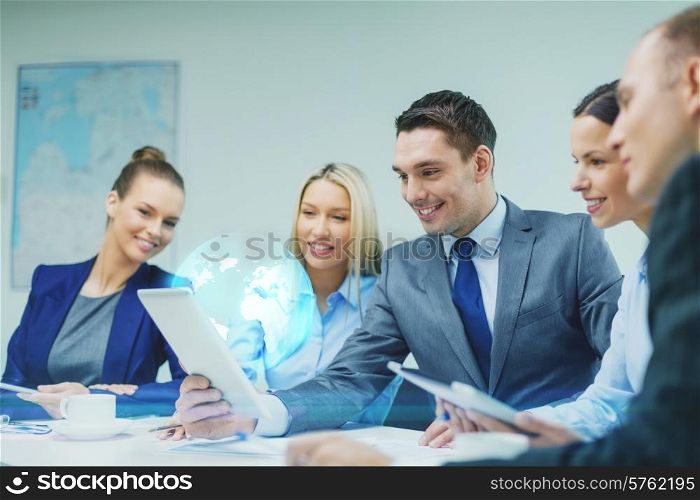 business, technology and people concept - smiling business team with tablet pc computer and virtual globe projection having discussion in office