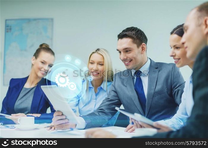 business, technology and people concept - smiling business team with tablet pc computer virtual settings projection having discussion in office