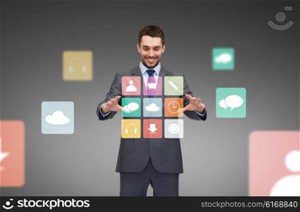 business, technology and people concept - smiling businessman working with menu icons projection