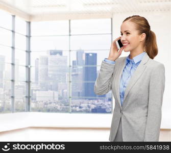 business, technology and people concept - smiling businesswoman calling on smartphone over office room or new apartment background