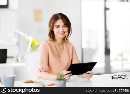 business, technology and people concept - smiling businesswoman with tablet pc computer working at office. businesswoman with tablet pc working at office. businesswoman with tablet pc working at office