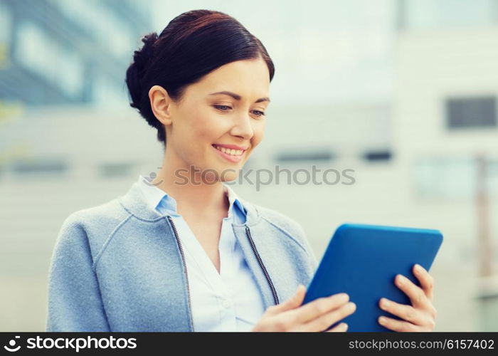 business, technology and people concept - young smiling woman with tablet pc computer over office building