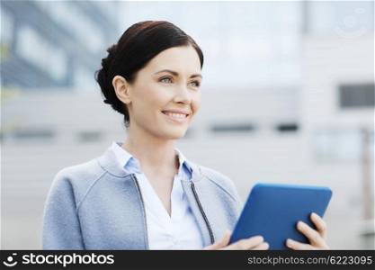 business, technology and people concept - young smiling woman with tablet pc computer over office building