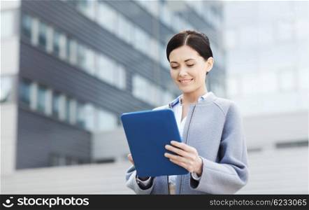 business, technology and people concept - young smiling woman with tablet pc computer over office building