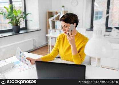 business, technology and ui design concept - creative woman with user interface templates calling on smartphone at office. ui designer calling on smartphone at office