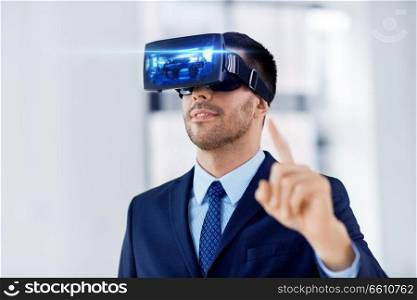 business, technology, augmented and virtual reality concept - businessman with some machine on display of vr headset at office. businessman with virtual reality headset at office