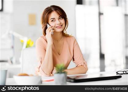 business, technology, communication and people concept - happy businesswoman calling on smartphone at office. businesswoman calling on smartphone at office. businesswoman calling on smartphone at office
