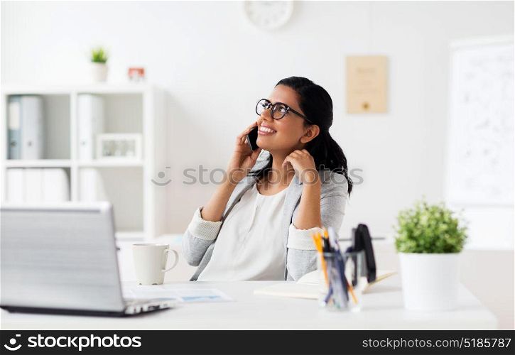 business, technology, communication and people concept - happy smiling businesswoman or secretary calling on smartphone at office. businesswoman calling on smartphone at office