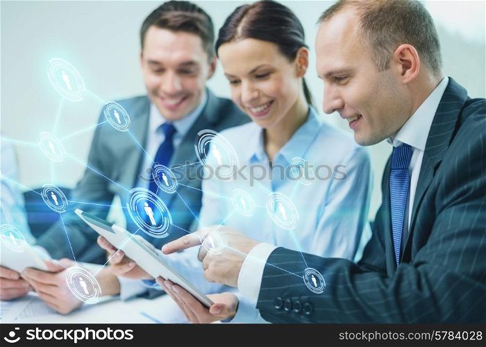 business, technology, connection, communication and people concept - smiling business team with tablet pc computer and virtual contacts projection having discussion in office