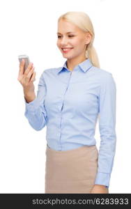 business, technology, internet and education concept - friendly young smiling businesswoman with smartphone