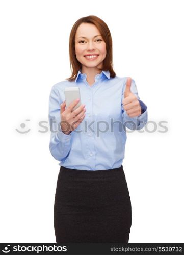 business, technology, internet and education concept - friendly young smiling businesswoman with smartphone showing thumbs up