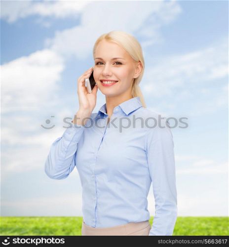 business, technology, internet and education concept - smiling young businesswoman with smartphone