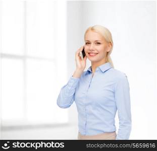 business, technology, internet and education concept - smiling young businesswoman with smartphone in white room