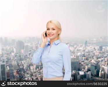 business, technology, internet and education concept - smiling young businesswoman with smartphone over cityscape background