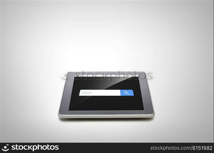 business, technology, internet and modern gadget concept - close up of tablet pc computer with browser search bar on screen gray background