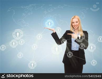 business, technology, internet and networking concept - businesswoman pointing at contact icons on virtual screen