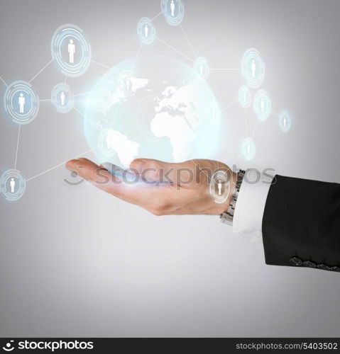 business, technology, internet and networking concept - man hand holding hologram with globe and contacts