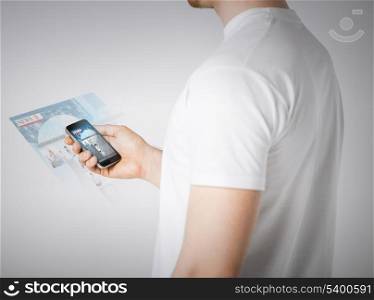 business, technology, internet and news concept - man with smartphone reading news