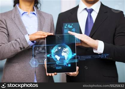 business, technology, internet and office concept - businessman and businesswoman with globe on tablet pc screen in office