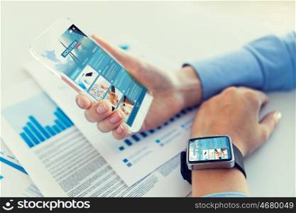 business, technology, mass media and people concept - close up of woman hand holding and showing showing news web page on transparent smartphone screen at office