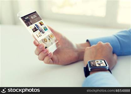 business, technology, media, internet and people concept - close up of woman hand holding and showing transparent smart phone with blog web page on screen and watch at office