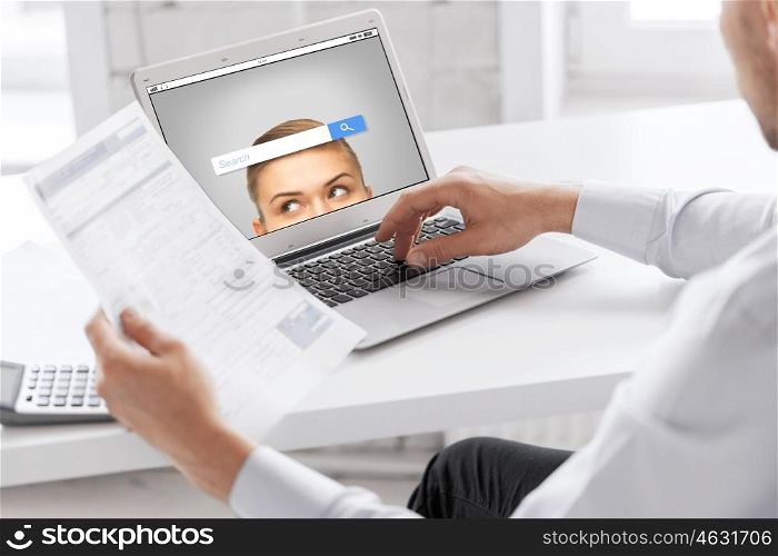 business, technology, multimedia and people concept - close up of businessman with internet browser search bar on laptop computer screen working at office