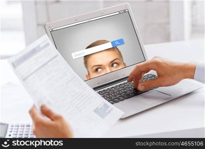 business, technology, multimedia and people concept - close up of businessman with internet browser search bar on laptop computer screen working at office