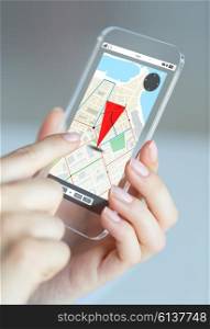 business, technology, navigation and people concept - close up of woman hand holding and showing transparent smartphone with gpas navigator map on screen