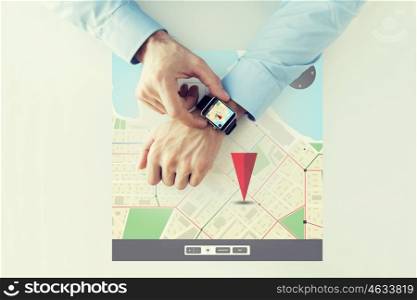 business, technology, navigation, location and people concept - close up of male hands setting smart watch with gps navigator map on screen