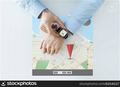 business, technology, navigation, location and people concept - close up of male hands setting smart watch with gps navigator map on screen