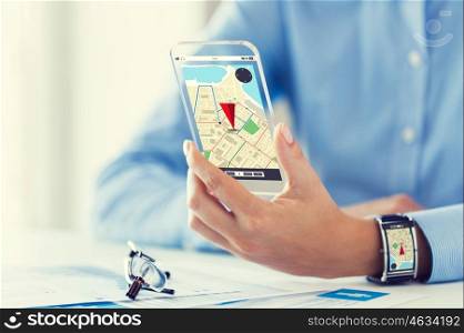 business, technology, navigation, location and people concept - close up of woman hand with gps navigator map on transparent smartphone and smart watch screen