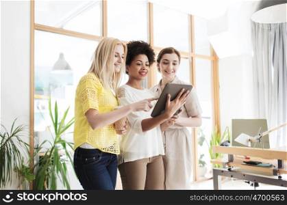 business, technology, people and teamwork concept - happy creative team with tablet pc computer in office