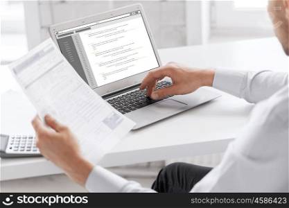 business, technology, programming and people concept - close up of businessman with coding on laptop computer screen working at office