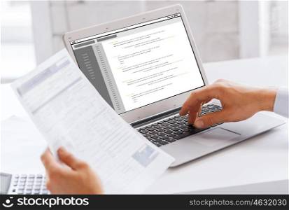 business, technology, programming and people concept - close up of businessman with coding on laptop computer screen working at office